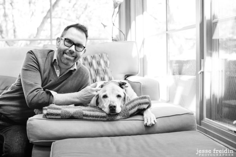 Gay Santa Fe Realtor Mark Banham with his dog at home