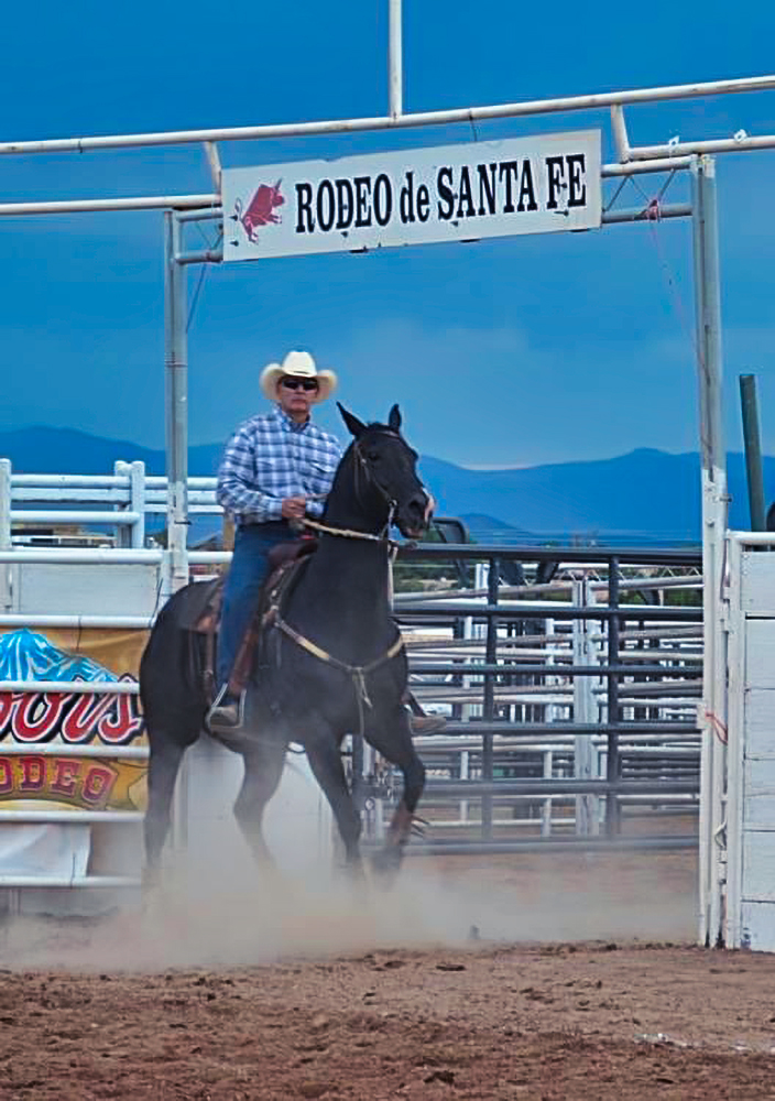Cowboy riding a horse at the Gay Santa Fe Rodeo which turns 30 this year